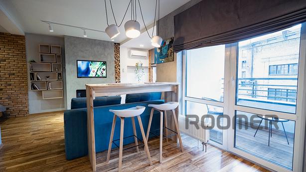 Loft studio with fireplace, new building, Kyiv - apartment by the day