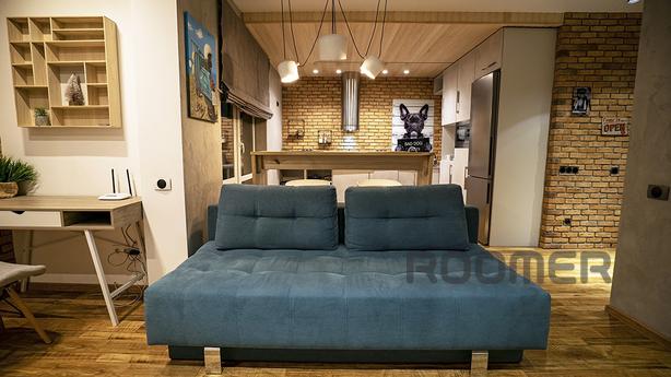 Loft studio with fireplace, new building, Kyiv - apartment by the day