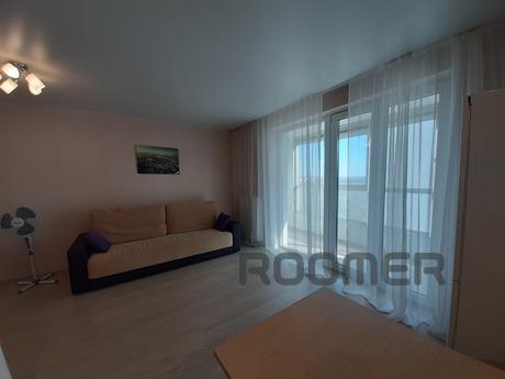 The 1-room studio apartment is located on the 15th floor of 