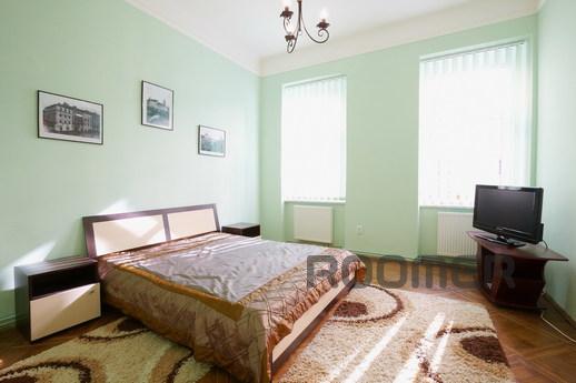 The apartment is located in the historic center of Lviv, in 
