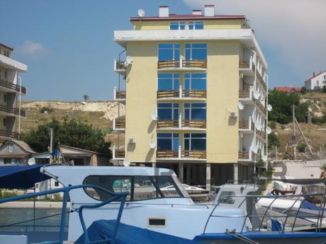 The apartment is located on the shore of the bay (25 m from 