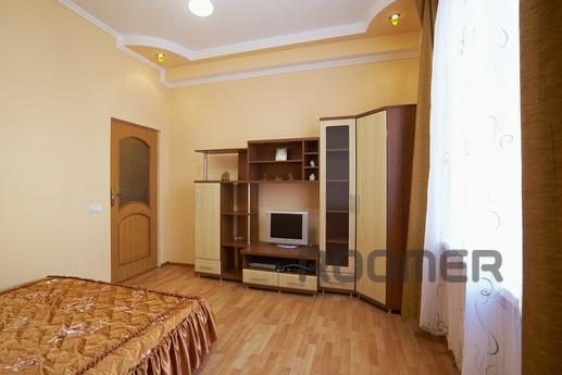 This apartment is located in a tiny Lviv street facing Opera